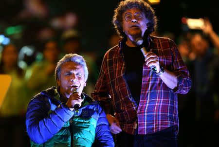 Lenin Moreno, (L) presidential candidate from the ruling PAIS Alliance party, sings with Argentine singer Piero during a campaign rally in Quito, Ecuador, February 15, 2017. REUTERS/Mariana Bazo