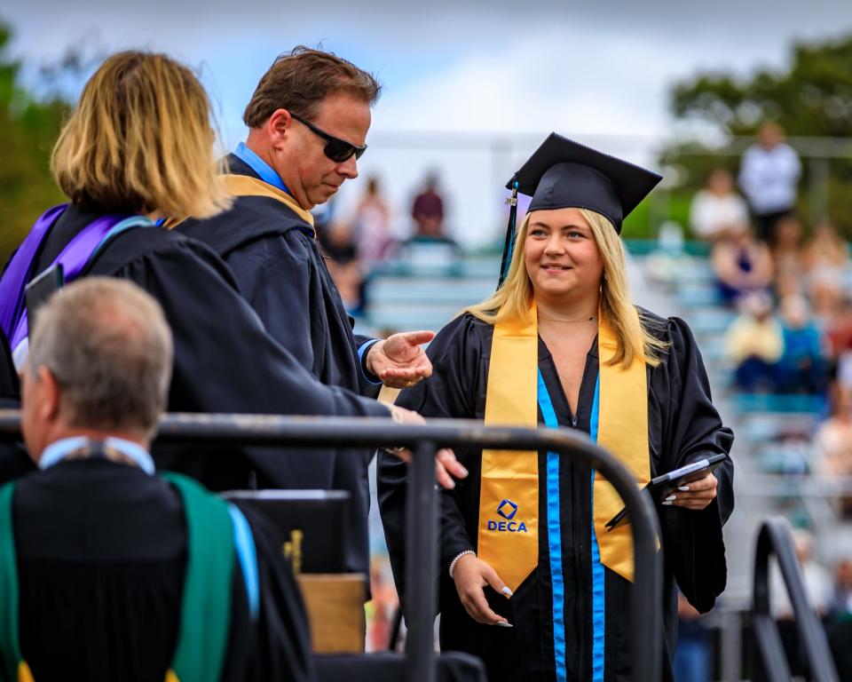 Ella Rose is all smiles after receiving her diploma at Plymouth South High School on June 4, 2022.