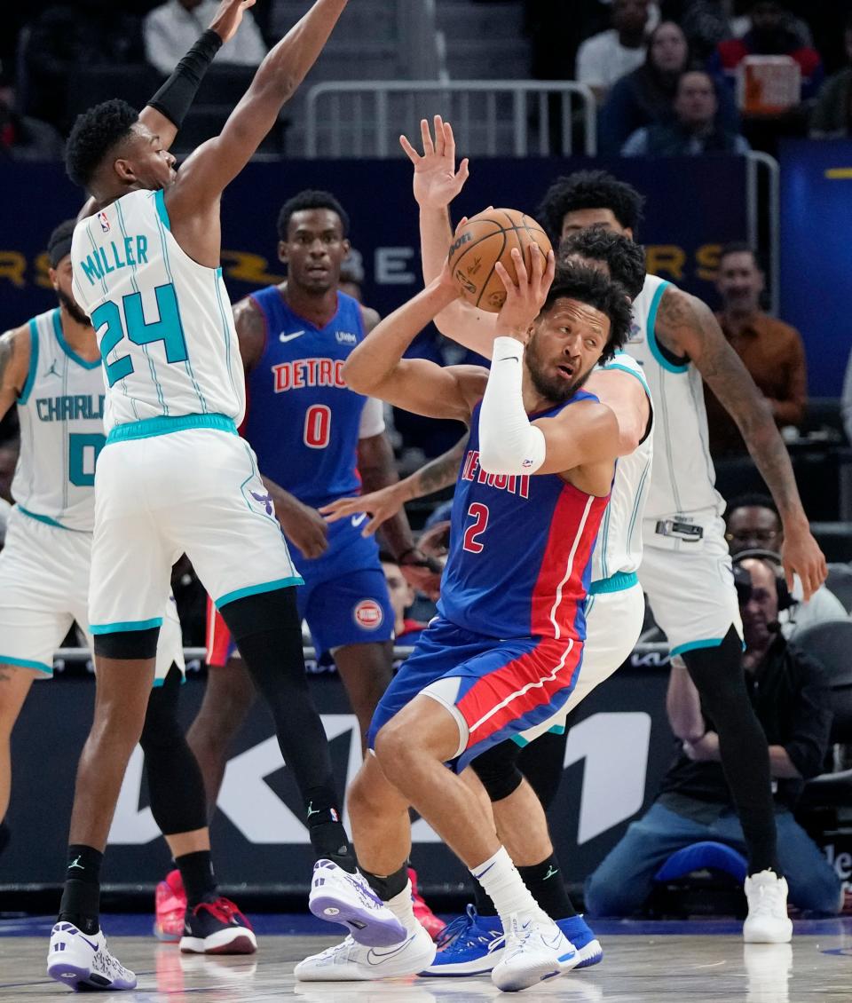 Detroit Pistons guard Cade Cunningham (2) is defended by Charlotte Hornets forward Brandon Miller (24) during the first half at Little Caesars Arena in Detroit on Monday, March 11, 2024.