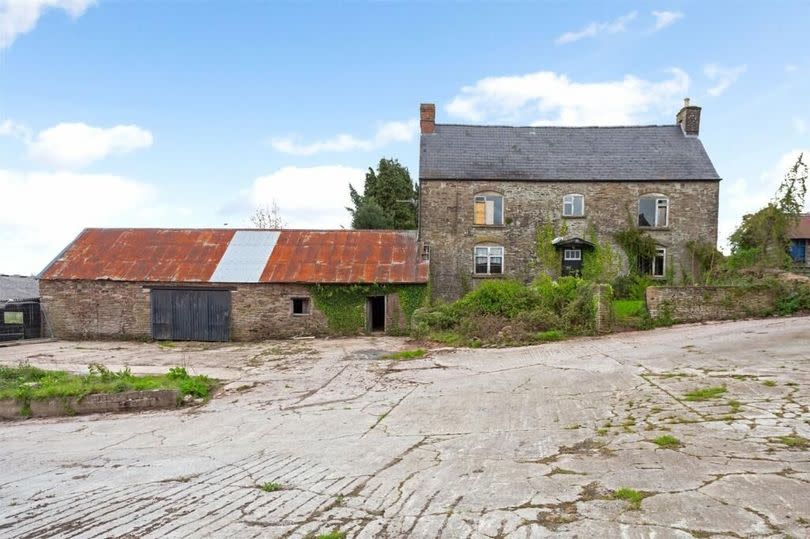 farmhouse and outbuilding