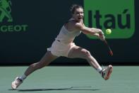 Mar 24, 2018; Key Biscayne, FL, USA; Simona Halep of Romania reaches for a backhand against Agnieszka Radwanska of Poland (not pictured) on day five of the Miami Open at Tennis Center at Crandon Park. Radwanska won 3-6, 6-2, 6-3. Mandatory Credit: Geoff Burke-USA TODAY Sports