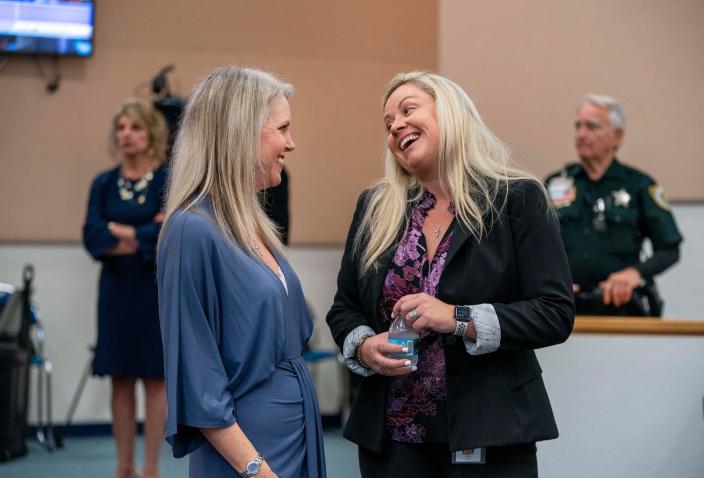 Newly elected County Commissioner Sara Baxter, right, talks to outgoing commissioner Melissa McKinlay before being sworn in at the Governmental Center in West Palm Beach. Baxter, who will represent District 6, is one of two new Republican county commissioners.