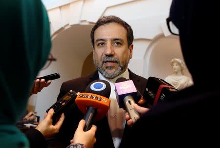 Iran's top nuclear negotiator Abbas Araqchi talks to journalists after meeting senior officials from the United States, Russia, China, Britain, Germany and France in a hotel in Vienna, Austria, October 19, 2015. REUTERS/Heinz-Peter Bader