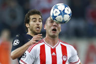 Football Soccer - Olympiacos v Arsenal - UEFA Champions League Group Stage - Group F - Georgios Karaiskakis Stadium, Piraeus, Greece - 9/12/15 Arsenal's Mathieu Flamini in action with Olympiacos' Pajtim Kasami Action Images via Reuters / Andrew Couldridge Livepic EDITORIAL USE ONLY.