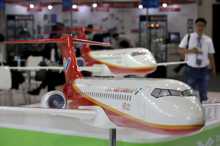 FILE PHOTO: Models of the ARJ21 regional jet from Commercial Aircraft Corp of China (COMAC) are displayed at the Aviation Expo China 2015 in Beijing, China, September 16, 2015. REUTERS/Jason Lee/File Photo