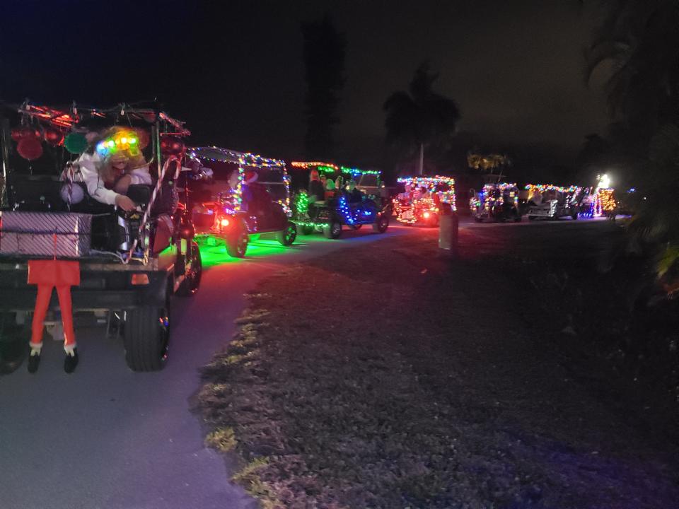 Isles of Capri's annual golf cart parade passes each restaurant in the community on Dec. 24 at sundown.