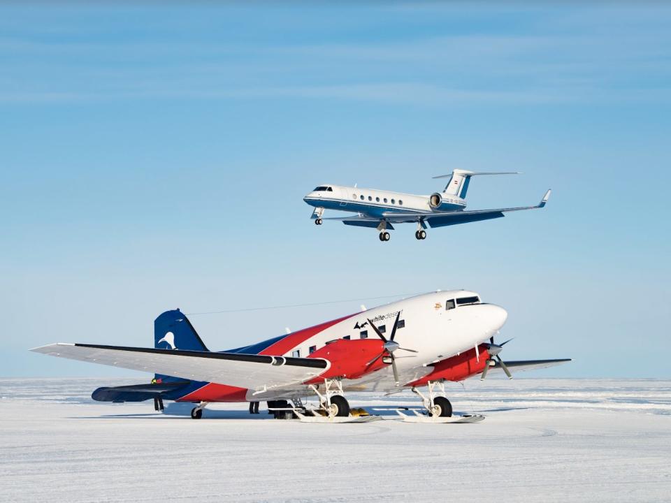 A ski plane on Wolf's Fang Runway while the G550 is landing behind.