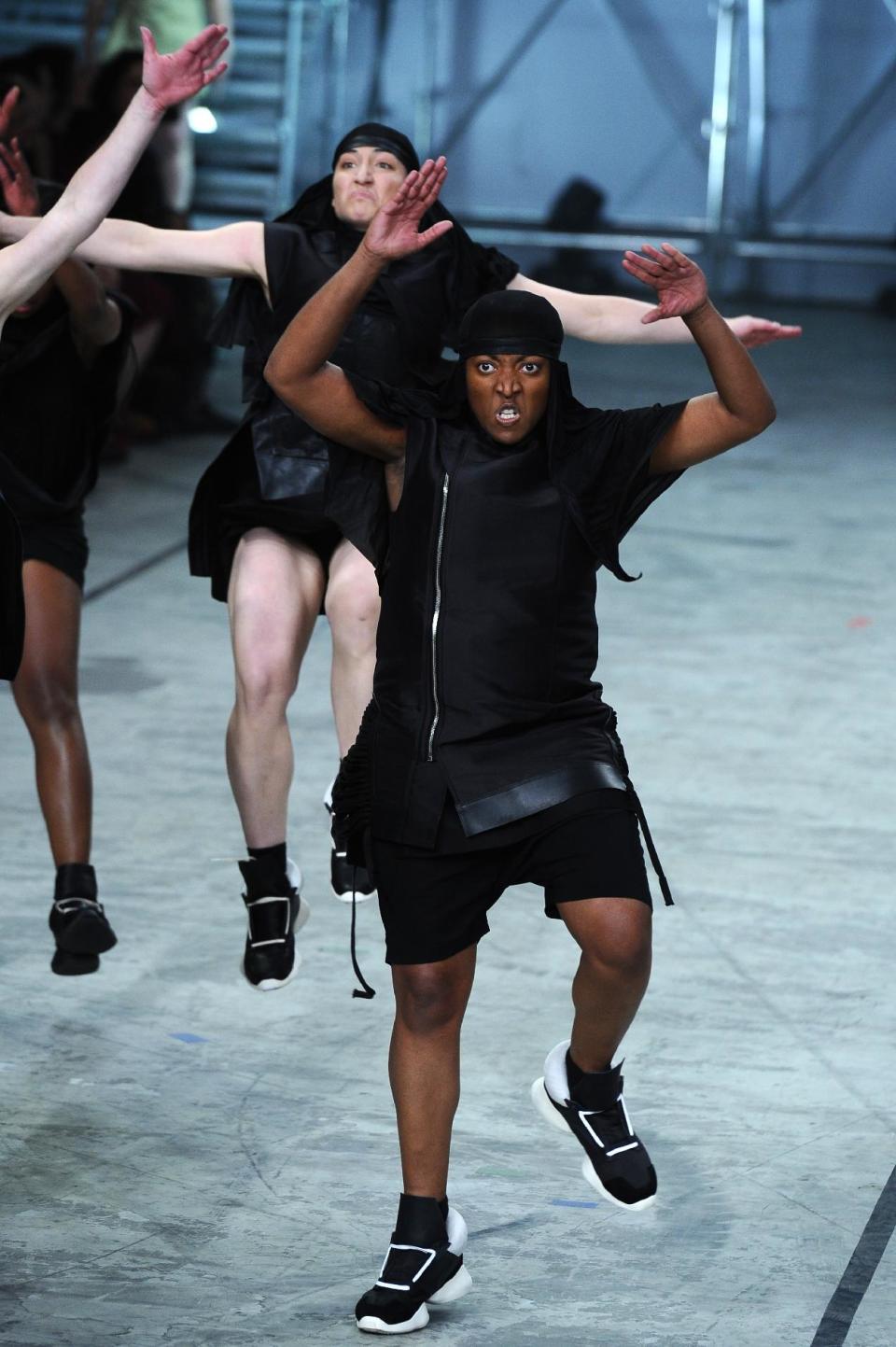 Models present creations as part of fashion designer Rick Owens ready-to-wear Spring/Summer 2014 fashion collection presented in Paris, Thursday, Sept. 26, 2013. (AP Photo/Zacharie Scheurer)