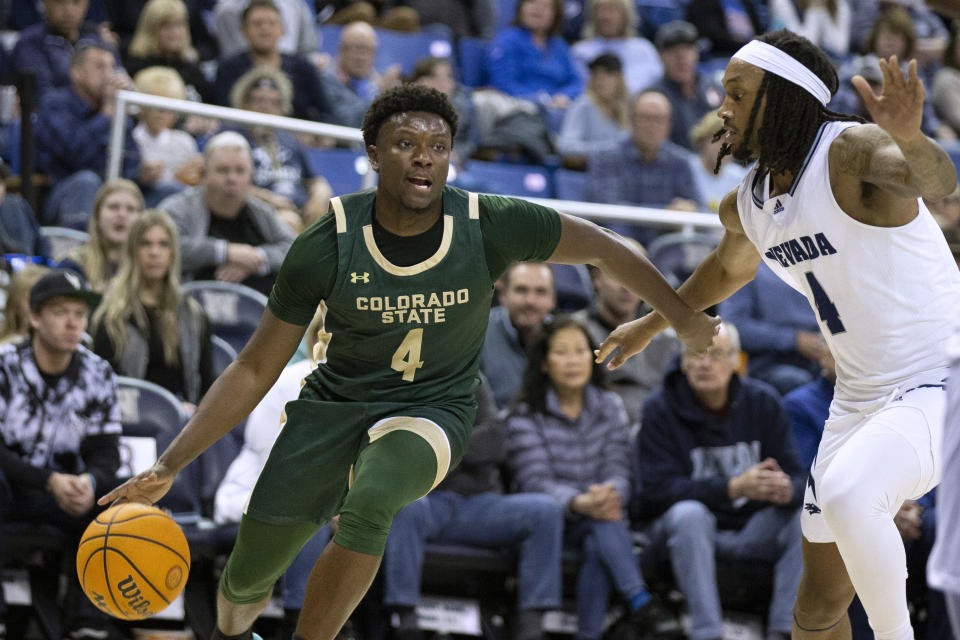 Colorado State guard drives against Nevada forward Tré Coleman (4) during the second half of an NCAA college basketball game Wednesday, Jan. 24, 2024, in Reno, Nev. (AP Photo/Tom R. Smedes)