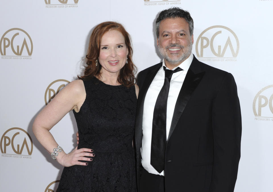 FILE - This Jan. 23, 2016 file photo shows Oscars producers Jennifer Todd, left, and Michael De Luca at the 27th Annual Producers Guild Awards in Los Angeles. Although the first-time Oscar telecast producers may want their show to focus on the magic of the movies, they say they support any message spoken from the heart, even if it means turning the Oscar podium into a political pulpit. (Photo by Richard Shotwell/Invision/AP, File)