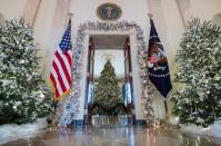 <p>Christmas trees are seen during a preview of holiday decorations in the Grand Foyer of the White House in Washington, D.C., Nov.27, 2017. (Photo: Saul Loeb/AFP/Getty Images) </p>