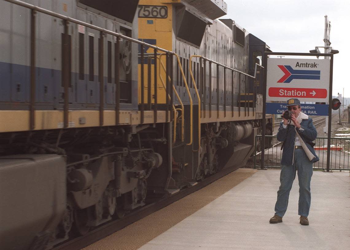 The scheduled return of Amtrak passenger train service to Ashland was postponed this morning, Wednesday March 11, 1998. The train was stranded up north due to bad weather but the ceremony marking the return was held anyway at the new Ashland Transpotation Center located at 15th St and the Ohio Riverfront in downtown Ashland. SEE STORY- Don Childers came to video the passenger train but had to settle for a passing coal train. He worked for the railroad in Ashland for 37 years and is one of 4 generations of his family to work for railroads CHARLES BERTRAM/LEXINGTON HERALD LEADER