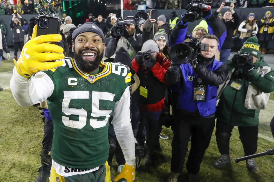 Green Bay Packers' Za'Darius Smith smiles as he takes a selfie after an NFL divisional playoff football game against the Seattle Seahawks Sunday, Jan. 12, 2020, in Green Bay, Wis. The Packers won 28-23 to advance to the NFC Championship. (AP Photo/Mike Roemer)