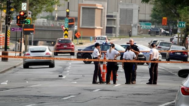 Montreal police established a perimeter near the intersection of Viger Avenue and Sanguinet Street on Wednesday evening after the collision. (Mathieu Wagner/Radio-Canada - image credit)