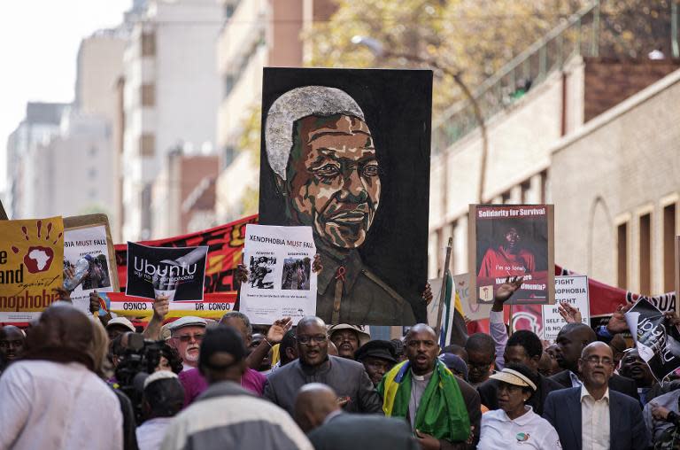 Thousands march against the recent wave of xenophobic attacks in South Africa through the streets of Johannesburg CBD on April 23, 2015