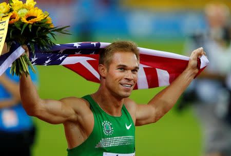 Nick Symmonds of the U.S. celebrates after winning the men's 800 metres at the Weltklasse Diamond League athletics meeting in Zurich August 29, 2013. REUTERS/Ruben Sprich