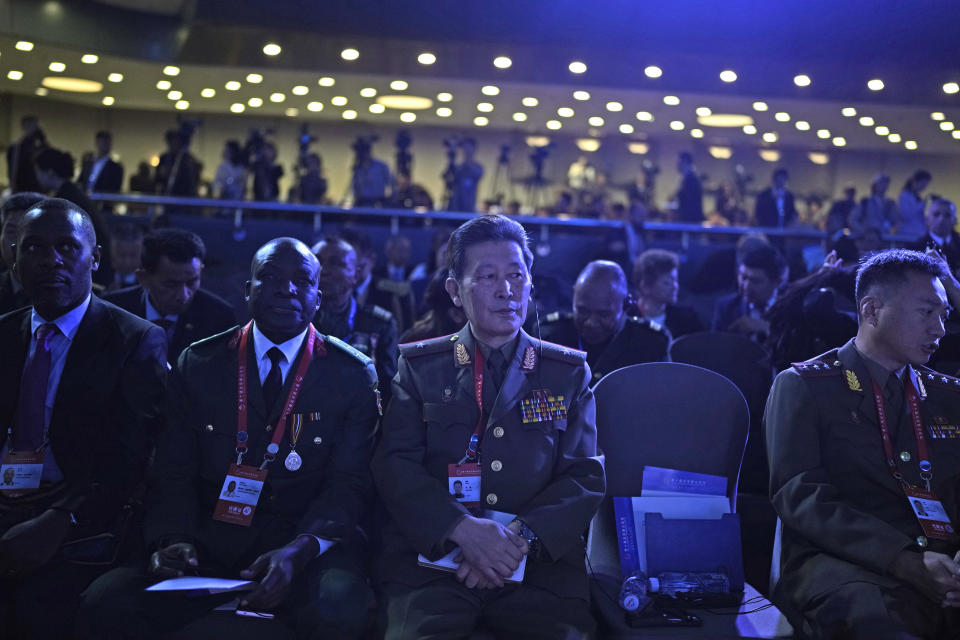 A North Korean military officer, center, attends the 10th Beijing Xiangshan Forum in Beijing, Tuesday, Oct. 31, 2023. Singapore's Defense Minister Ng Eng Hen called on China, as a dominant power in Asia, to take the lead in reducing tensions by being a benevolent one, warning that military conflict like the wars in Ukraine and Gaza would be devastating to the region's future. (AP Photo/Ng Han Guan)