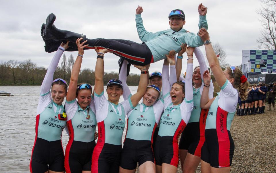 Cambridge women's rowers hoist James Trotman above their heads - Shuttershock/Mark Thomas