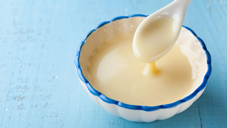 Sweetened condensed milk in a small bowl