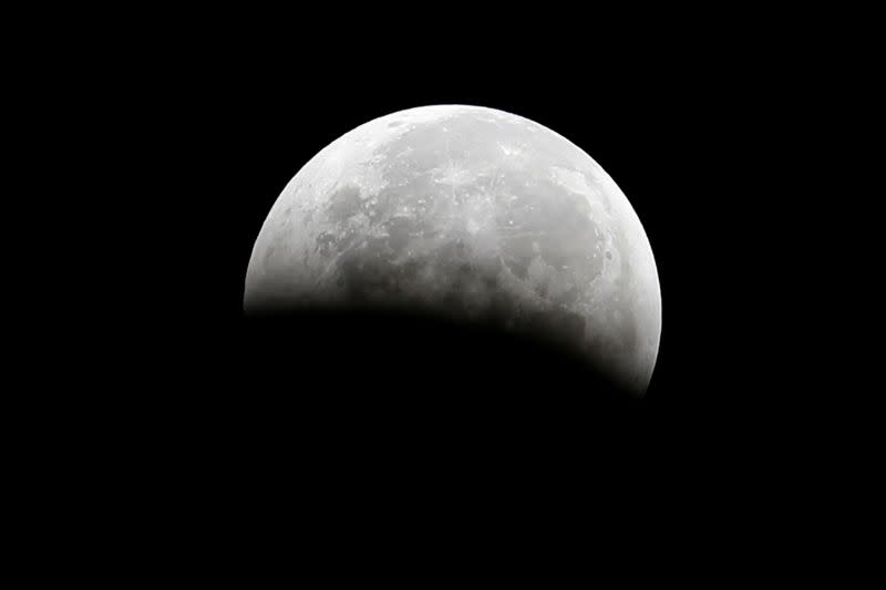 FILE PHOTO: A total lunar eclipse, also known as a "blood moon", is pictured from Santa Monica