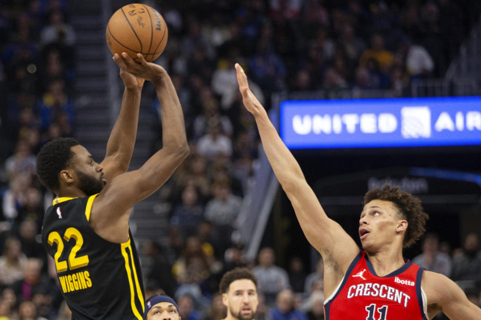 Golden State Warriors forward Andrew Wiggins (22) shoots over New Orleans Pelicans guard Dyson Daniels (11) during the second quarter of an NBA basketball game, Wednesday, Jan. 10, 2024, in San Francisco. (AP Photo/D. Ross Cameron)