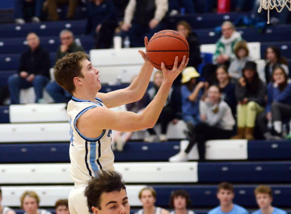 Petoskey's Shane Izzard finishes off a TC West turnovers with points at the other end during Tuesday's Big North Conference matchup.