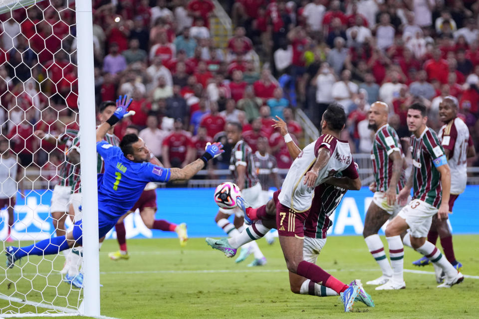 Al Ahly's Kahraba, center, tries to score during the Soccer Club World Cup semifinal soccer match between Fluminense FC and Al Ahly FC at King Abdullah Sports City Stadium in Jeddah, Saudi Arabia, Monday, Dec. 18, 2023. (AP Photo/Manu Fernandez)