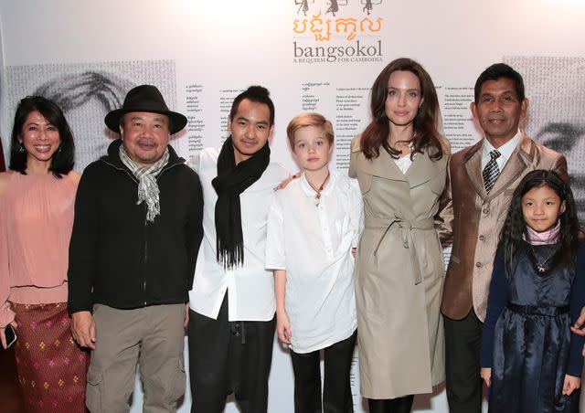 <p>Cindy Ord/Getty </p> Angelina Jolie with her kids Maddox Chivan Jolie-Pitt and Shiloh Nouvel Jolie-Pitt with Loung Ung, Rithy Panh and Him Sophy at Bangsokol: A Requiem for Cambodia on Dec. 16, 2017 in New York City.