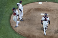 Atlanta Braves starting pitcher Kyle Wright is taken out of the game against the Los Angeles Dodgers during the first inning in Game 3 of a baseball National League Championship Series Wednesday, Oct. 14, 2020, in Arlington, Texas. (AP Photo/David J. Phillip)