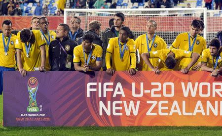 Members of the team from Brazil react after being defeated by Serbia in the final of the U20 Soccer World Cup in Auckland, New Zealand, June 20, 2015. REUTERS/Carlos Sarraf