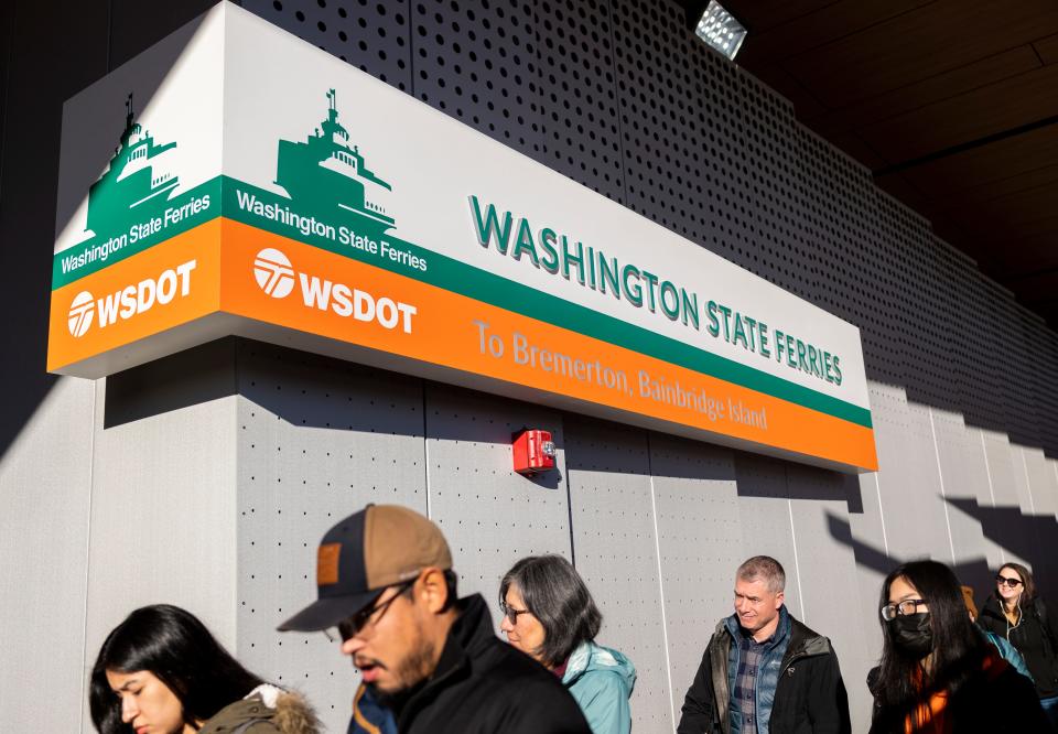 Passengers walking off the ferry Walla Walla and by the newly expanded state ferry terminal building at Colman Dock on Friday.