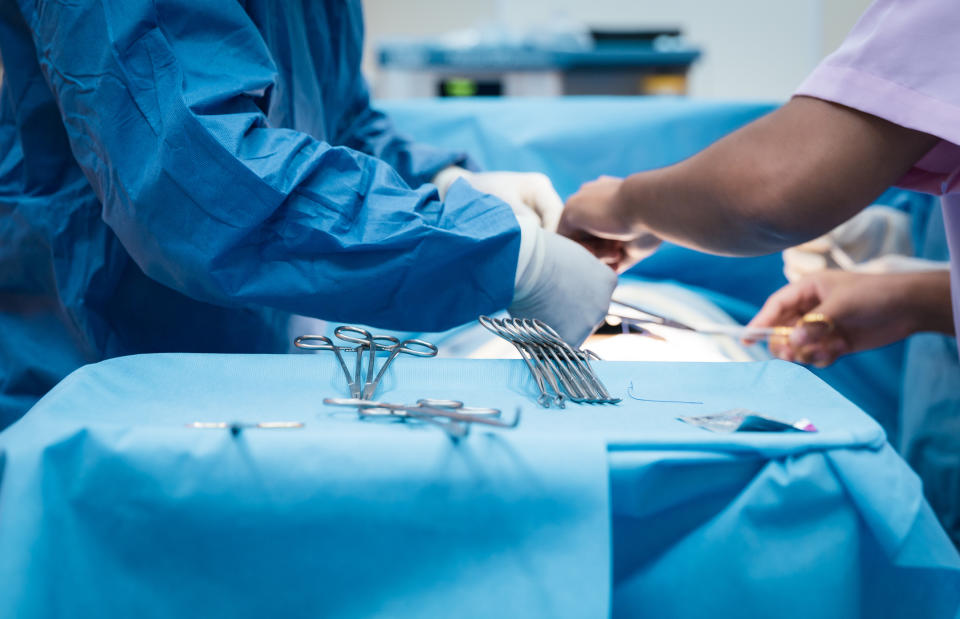 doctors and surgeons working on a patient