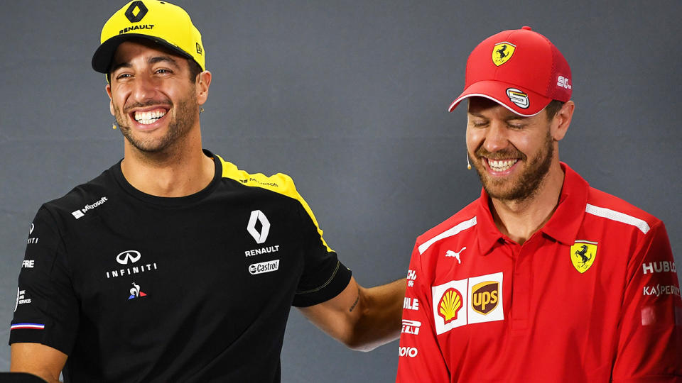 Daniel Ricciardo and Sebastian Vettel, pictured here speaking to the media at a press conference.