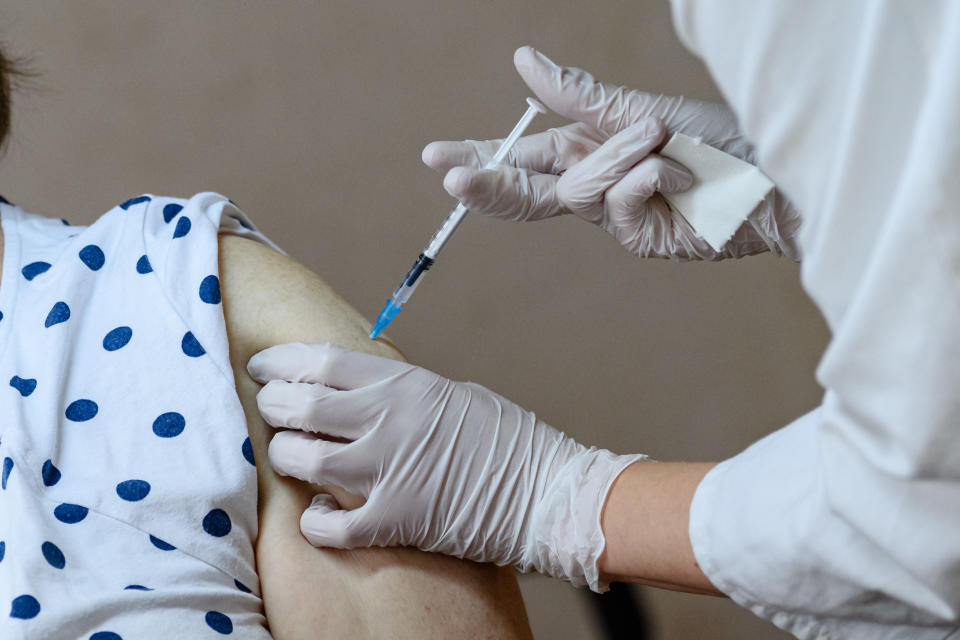 LEIPZIG, GERMANY - MAY 10: A doctor inoculates a patient with the Pfizer/BioNTech vaccine against Covid-19 at a mobile vaccination center in the Markkleeberg suburb town hall on May 10, 2021 in Leipzig, Germany. Germany has succeeded in accelerating its nationwide vaccinations in recent weeks. Approximately one third of the population has received a first dose. (Photo by Jens Schlueter/Getty Images)