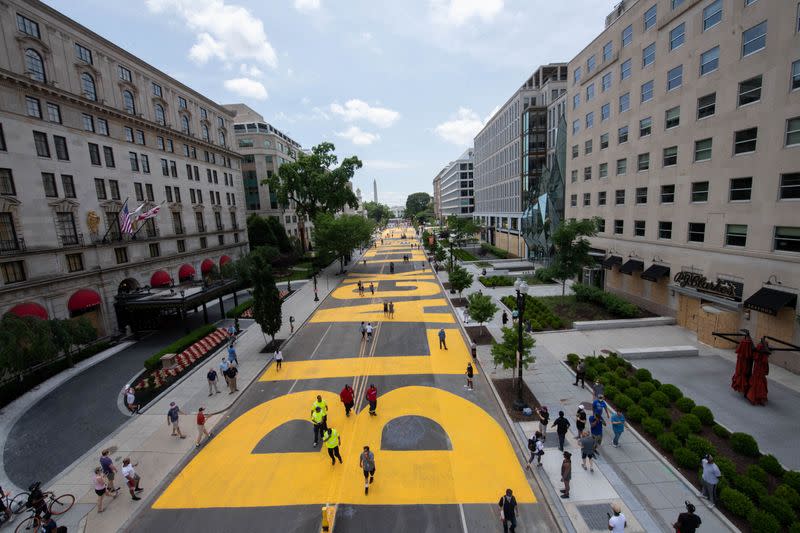 A Black lives matter sign is painted on a street in Washington, D.C.