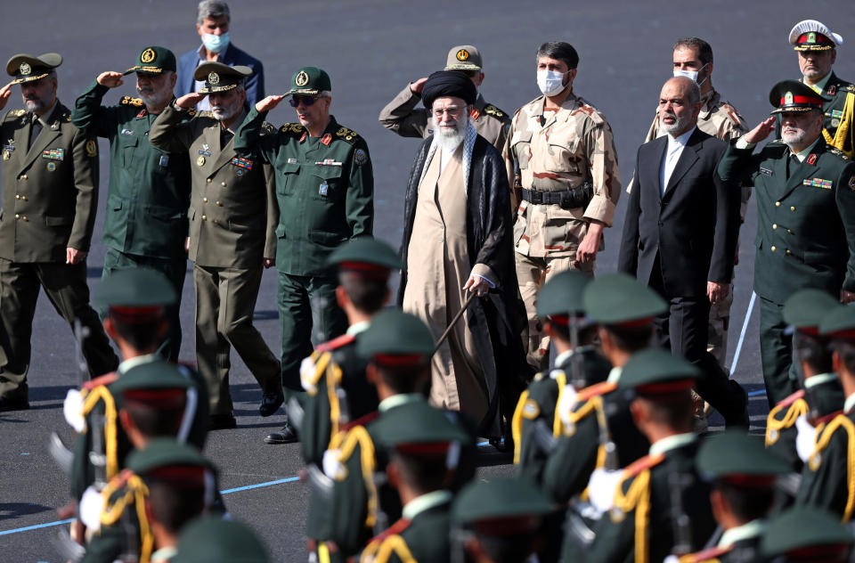 In this picture released by the official website of the office of the Iranian supreme leader, Supreme Leader Ayatollah Ali Khamenei, center, reviews a group of armed forces cadets during their graduation ceremony accompanied by commanders of the armed forces, at the police academy in Tehran, Iran, Monday, Oct. 3, 2022. Khamenei responded publicly on Monday to the biggest protests in Iran in years, breaking weeks of silence to condemn what he called “rioting” and accuse the U.S. and Israel of planning the protests. (Office of the Iranian Supreme Leader via AP)