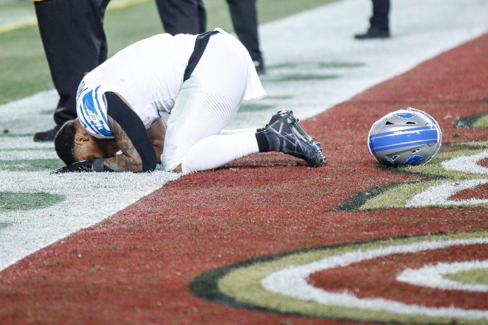 Detroit Lions running back David Montgomery falls to the ground after the Lions' 34-31 loss in the NFC championship game in Santa Clara, California, on Sunday, Jan. 28, 2024.
