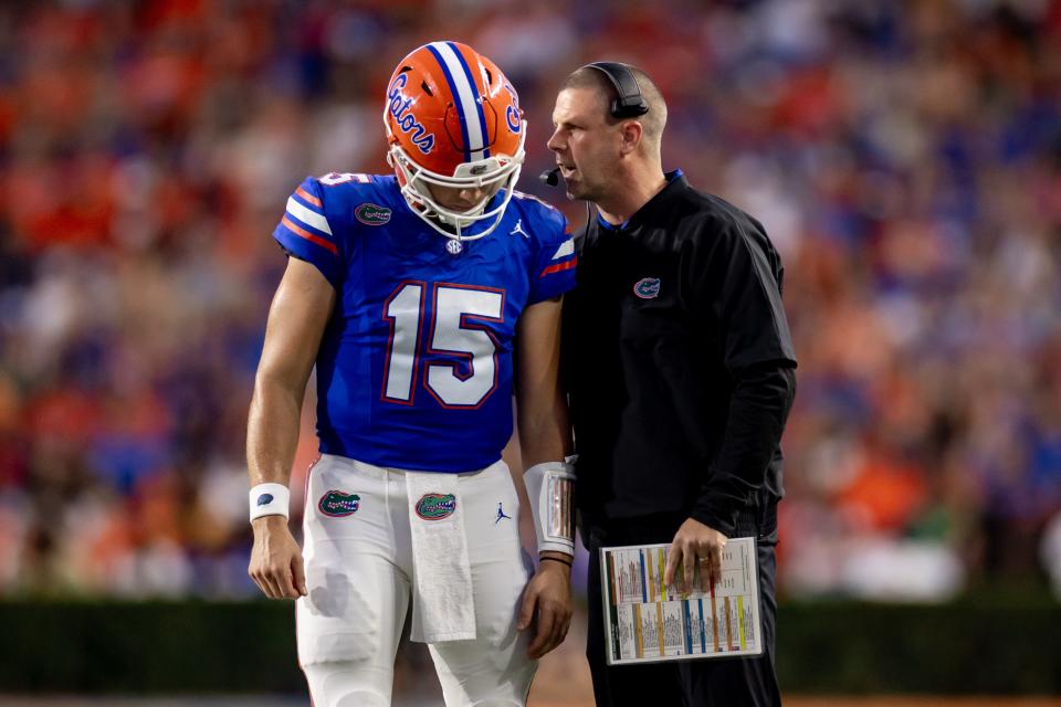 Florida Gators head coach Billy Napier and Florida Gators quarterback Graham Mertz (15) talk during a timeout during the first half against the Charlotte 49ers at Steve Spurrier Field at Ben Hill Griffin Stadium in Gainesville, FL on Saturday, September 23, 2023. [Matt Pendleton/Gainesville <a class="link " href="https://sports.yahoo.com/wnba/teams/connecticut/" data-i13n="sec:content-canvas;subsec:anchor_text;elm:context_link" data-ylk="slk:Sun;sec:content-canvas;subsec:anchor_text;elm:context_link;itc:0">Sun</a>]