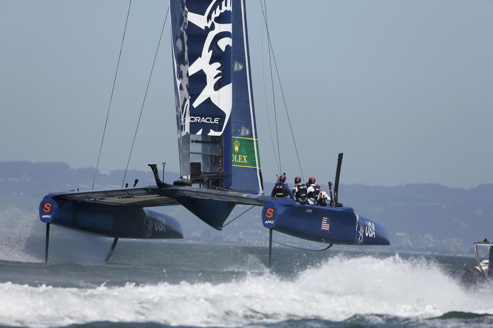 The U.S. team F50 foiling catamaran trains after its launch Monday, April 22, 2019, in San Francisco. New global sports league SailGP launched the first of six F50 race boats into San Francisco Bay that will compete May 4-5. The 50-foot long catamaran is capable of hitting speeds of 60 miles per hour. (AP Photo/Eric Risberg)