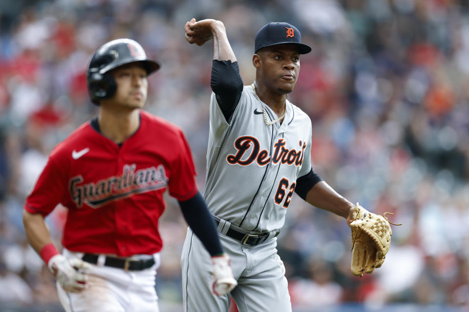 Detroit Tigers relief pitcher Angel De Jesus throws out Cleveland Guardians' Steven Kwan at first base during the third inning of a baseball game Saturday, July 16, 2022, in Cleveland. (AP Photo/Ron Schwane)