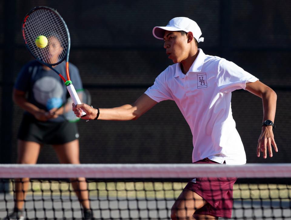 Hereford's Nicholas Villalovos hits a volley at the Region I-4A mixed double championship match, Thursday, April 14, 2022, at McLeod Tennis Center. Hereford won, 6-2, 6-2.