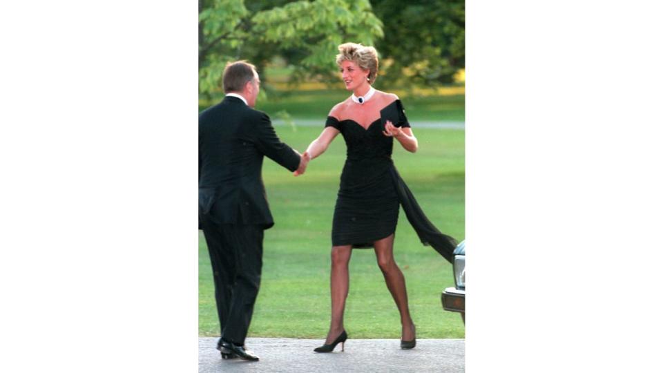  Diana, Princess of Wales wears the famous black "revenge dress" 