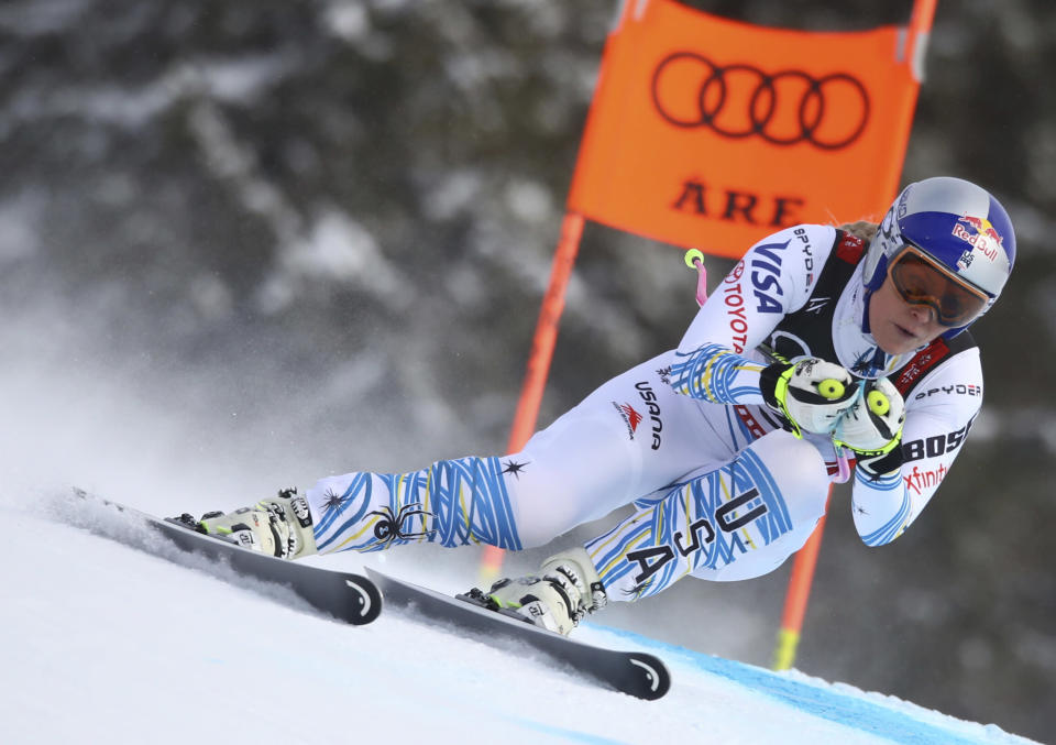 FILE - Lindsey Vonn speeds down the course during the women's downhill race, at the alpine ski World Championships in Are, Sweden, Sunday, Feb. 10, 2019. Vonn details in a column for The Associated Press on Tuesday, Dec. 28, 2021 the mental health challenges she faced after retiring from ski racing. The most successful female ski racer of all time says she needed to find a new outlet after releasing all of her troubles on the mountain for so many years. (AP Photo/Alessandro Trovati, file)