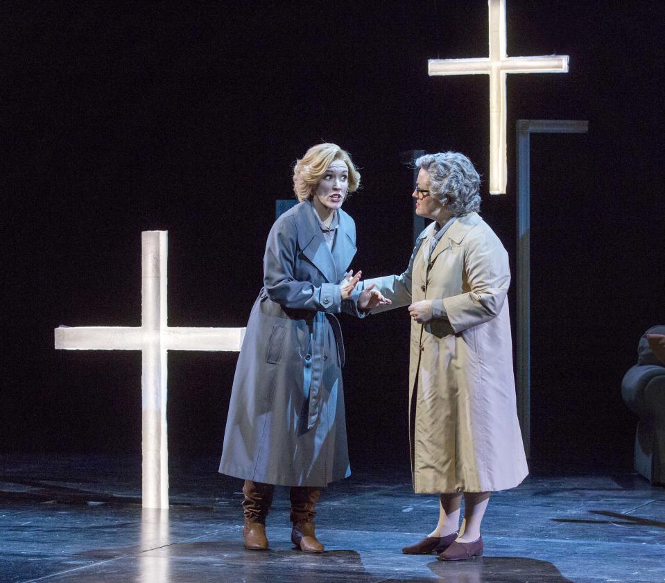 In this Feb. 22, 2013 photo provided by the New York City Opera, cast members of the the New York City Opera Sara Jakubiak as the Governess, left, and Sharmay Musacchio as Mrs. Grose perform during a dress rehearsal of “The Turn of the Screw,” at the Brooklyn Academy of Music in New York. (AP Photo/New York City Opera, Richard Termine)