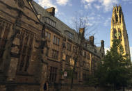 FILE - This Sept. 9, 2016, file photo shows Harkness Tower on the campus of Yale University in New Haven, Conn. Yale University is requiring its faculty and staff to get coronavirus vaccinations before the 2021 fall term, extending a requirement already imposed for students. The private university says faculty members, staffers and academic trainees must be fully inoculated by Aug. 1, 2021, although there are provisions for exemptions for reasons based on medical conditions or religious or “strongly held” personal beliefs. (AP Photo/Beth J. Harpaz, File)