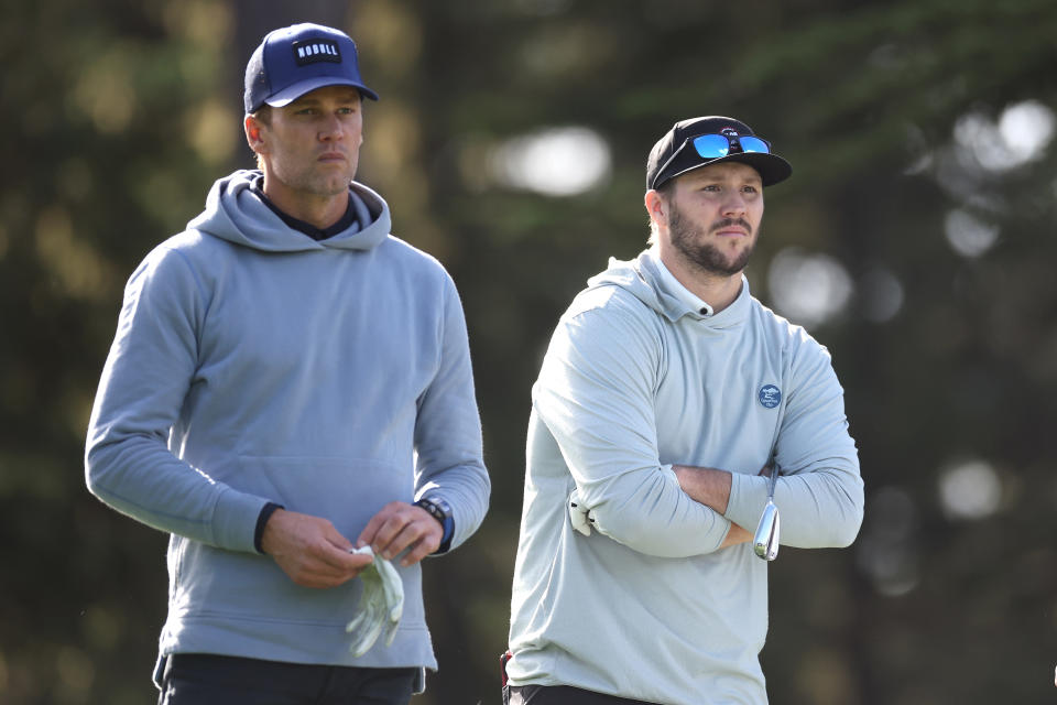 Former NFL quarterback Tom Brady, left, and Josh Allen of the NFL Buffalo Bills look on during the first round of the AT&T Pebble Beach Pro-Am at Spyglass Hill Golf Course on February 01, 2024 in Pebble Beach, California. (Photo by Ezra Shaw/Getty Images)
