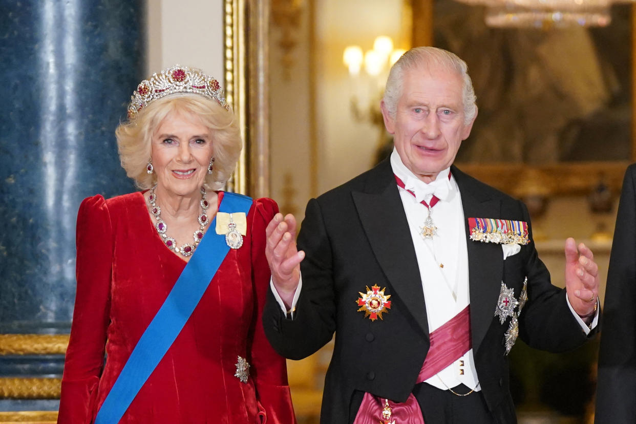 Britain's Queen Camilla (L) and Britain's King Charles III (R) welcome  South Korea's President Yoon Suk Yeol and his wife Kim Keon Hee during a State Banquet at Buckingham Palace in central London on November 21, 2023, on the first day of a three-day state visit to the UK. South Korean President Yoon Suk Yeol and First Lady Kim Keon Hee began a three-day trip to the UK on Tuesday, with King Charles III's hosting his first state visitors since his coronation. (Photo by Yui Mok / POOL / AFP) (Photo by YUI MOK/POOL/AFP via Getty Images)