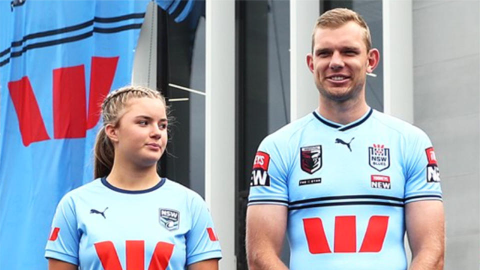 Pictured left to right, Emma Tonegato and Tom Trbojevic pose in the Blues' new-look State of Origin jerseys.