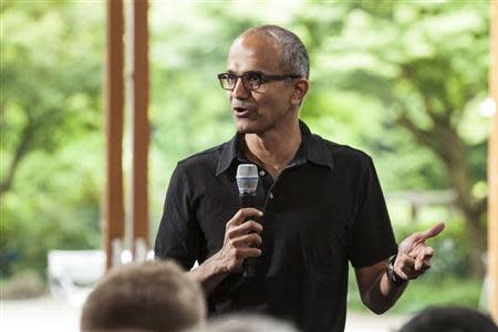 Satya Nadella, executive vice president, Cloud and Enterprise, addresses employees during the One Microsoft Town Hall event in Seattle, Washington in this July 11, 2013 photo made available to Reuters on January 30, 2014. REUTERS/Microsoft/Handout