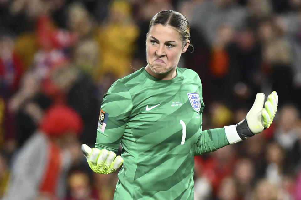 England's goalkeeper Mary Earps reacts after saving Spain's penalty kick during the Women's World Cup soccer final between Spain and England at Stadium Australia in Sydney, Australia, Sunday, Aug. 20, 2023. (AP Photo/Steve Markham)